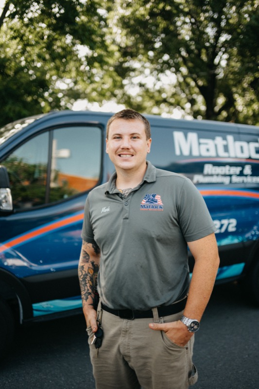 Matlock crew member standing confidently by the fleet